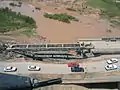 Aerial view of the nearly complete erection of a Medium Girder Bridge over the Kazer River, Mosul, Iraq, 2003.
