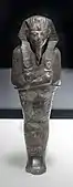 Ushabti of Amenhotep II; 1427–1400&nbsp;BC; serpentine; 29 × 9 × 0.65&nbsp;cm, 1.4&nbsp;kg; British Museum (London)