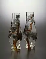 Rousseau-designed pair of pine tree vases (1878–84)Rousseau has adopted the cameo technique found in 18th-century Chinese glass. The Japanese-inspired pine tree designs have been created by cutting away portions of the surface of the glass to reveal the different colours within.Walters Art Museum