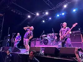 Descendents performing at the Fillmore Auditorium in 2022.
Left to right: Egerton, Aukerman, Stevenson (behind drum kit), and Alvarez.