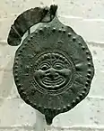 Disk-fibula with a gorgoneion, bronze with repoussé decoration, second half of the 6th&nbsp;century&nbsp;BC (Louvre)