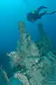 Diver near an old gun mount