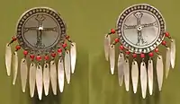 Earrings made of shell, brass and beads