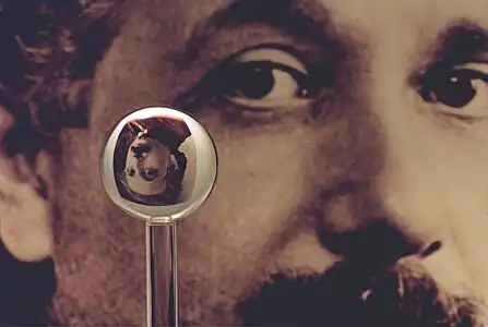 An image of one of the most accurate human-made spheres, as it refracts the image of Einstein in the background. This sphere was a fused quartz gyroscope for the Gravity Probe B experiment, and differs in shape from a perfect sphere by no more than 40 atoms (less than 10&nbsp;nm) of thickness. It was announced on 1 July 2008 that Australian scientists had created even more nearly perfect spheres, accurate to 0.3&nbsp;nm, as part of an international hunt to find a new global standard kilogram.