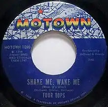 A blue vinyl record of the single appears