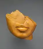 Fragment of a queen's face; 1353–1336&nbsp;BC; yellow jasper; height: 13&nbsp;cm, width: 12.5&nbsp;cm, depth: 12.5&nbsp;cm; Metropolitan Museum of Art