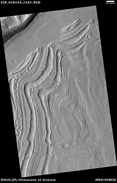 Well-developed hollows, as seen by HiRISE under the HiWish program.  Hollows are on floor of a crater with concentric crater fill.  The hollows develop because of movements of ice-rich sediment.  There may be hundreds of metres of ice covered by a thin layer of sediments.  Location is Casius quadrangle.