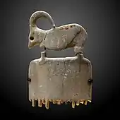 Ibex comb; 3800–3500&nbsp;BC; hippopotamus ivory; 6.5 × 3.8 × 0.2&nbsp;cm; Louvre