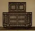 Wood and ivory corner cabinet