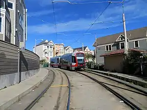 An inbound train at Right Of Way/21st Street, 2019