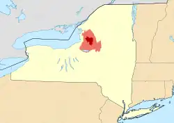 Map of New York State showing the greater Tug Hill region (light red), and its heavily forested "core" region (dark red). Core area based upon The Nature Conservancy's 150,000-acre (610&nbsp;km2) delineation.