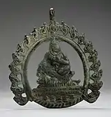 Pendant probably with Siddha; 8th–9th century; copper alloy; 8.89 by 7.93 by 0.31 centimetres (3.50&nbsp;in ×&nbsp;3.12&nbsp;in ×&nbsp;0.12&nbsp;in); Los Angeles County Museum of Art (Los Angeles)