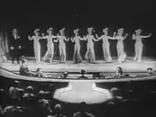 Nicky performs "Red Hot and Beautiful" at the burlesque Gaiety Theatre.