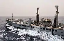 Wave Knight prepares to transfer fuel to the amphibious assault ship USS&nbsp;Bataan during a replenishment at sea.