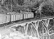 Narrow gauge coal train on a trestle bridge