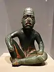 Seated shaman in ritual pose-shaped pendant (Olmec); 9th-5th century BC; serpentine and cinnabar; height: 18.5&nbsp;cm; Dallas Museum of Art (Dallas, Texas, US)