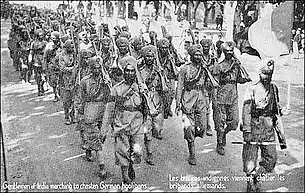 Postcard of marching Sikhs with rifles