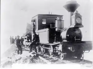 Macquarie Harbour breakwater construction, Tasmania. Ex Queensland railways locomotive.
