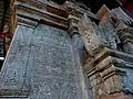 Stone images  featuring flora and mythical creature motifs in relief, similar in craftsmanship to those found in Bagan.