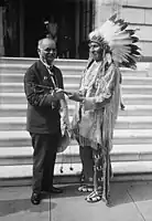 Vice President Curtis receives a peace pipe from Red Tomahawk, slayer of Sitting Bull