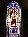 Basilique Notre-Dame-de-la-Joie : le vitrail du couronnement.