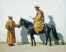 Homme sur un cheval noir