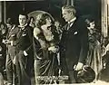 Vers le centre, de g. à d. : Harry von Meter, Francelia Billington et Charles Clary, dans The Day She Paid&nbsp;(en) (1919)
