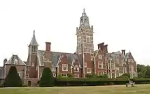 A photograph of a grand Victorian manor house