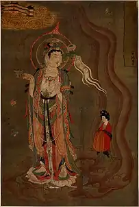Bodhisattva montrant la voie, couleurs sur soie, 80,5&nbsp;×&nbsp;53,8&nbsp;cm. Trouvé à Dunhuang (grotte 17). Le bodhisattva montre le chemin à une femme qui tient un brûle parfum dans sa droite et dans sa gauche une fleur de lotus. British Museum.