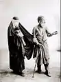 Un mendiant aveugle, une femme et un enfant.