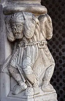 Les atlantes enchaînés de la cathédrale Sainte-Marie d'Oloron.