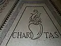 Mosaïque représentant le symbole de la charité (Cœur ardent)