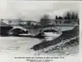 Dégâts causés par la crue de l'Aube, au pont de la rue de la Planche du Voit qui enjambe la Maze