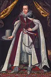 Peinture d'un jeune garçon portant un pantalon bouffant s'arrêtant aux genoux et une large cape rouge.