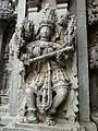 Saraswati avec livre et instrument de musique