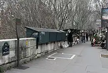 Panneau Histoire de Paris « Les bouquinistes », à l'angle du pont Marie et du quai de l'Hôtel-de-Ville.