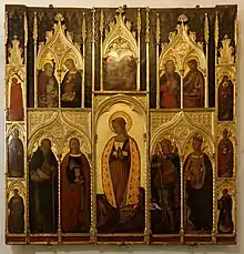 Retable peint et doré représentant plusieurs scènes religieuses.