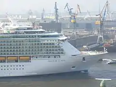 Cruise ship Freedom of the Seas, with drydock Elbe 17 on the background