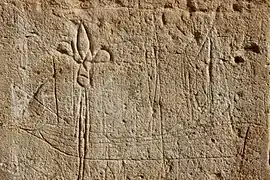 Graffito avec un navire et fleur de lys