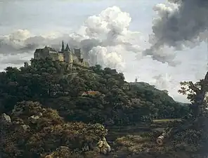 Château au sommet d'une colline très boisée.