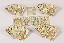 Jeu de cartes d'aluette ou de 'Vache' de l'atelier Veuve Roiné aîné de Nantes composé de 48 cartes