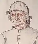 homme âgé très droit, en chapeau enveloppant la tête, habillé de gris clair.