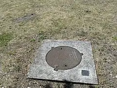 La tête de puits matérialisée.