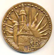 Médaille en bronze, 68&nbsp;mm, signée Laviolle, éditée pour le 4e&nbsp;centenaire de l'école, en 1962. Avers.