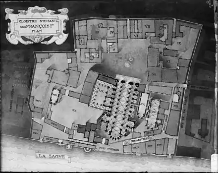 Plan ancien d'un centre-ville, au bord d'une rivière (située dans la partie basse), détaillant l'architecture des bâtiments. Une cathédrale est située au centre du plan.