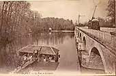 Une motrice du tramway circule sur le Pont d'Olivet, avant 1912