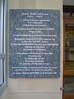 Notre-Dame du Laus - Plaque rappelant la restauration de l'hôtellerie en 1995.