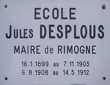 Photographie de la plaque indiquant le nom de l'école