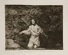 Un personnage seul sur ses genoux en haillons regarde désespérément vers le ciel.