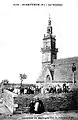 Saint-Sauveur (Finistère) ː le clocher de l'église et le calvaire vers 1930 (carte postale Émile Hamonic).